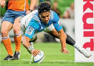  ?? PHOTO: PHOTOSPORT ?? Rieko Ioane scored a hat-trick as the Blues thumped the Rebels with a bonus point win to open the Super Rugby season.
