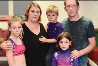  ??  ?? HEARTBROKE­N: Sarah and Stephen Holliday, pictured with their children, from left, Alesha, Joshua and Tiffany, saved for two years to raise the £3,500 for their California trip