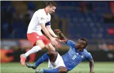  ?? — AFP ?? Italy’s Mario Balotelli (right) reacts to Poland’s Robert Lewandowsk­i during the UEFA Nations League match at Renato Dall’ara Stadium in Bologna.