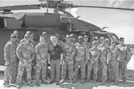  ?? PROVIDED BY 110TH PUBLIC AFFAIRS DETACHMENT VIA SEN. JACK REED ?? On a recent visit to Kosovo, U.S. Sen. Jack Reed visits with R.I. National Guard aviators from Company C (Medevac), 1/126th Aviation Battalion.