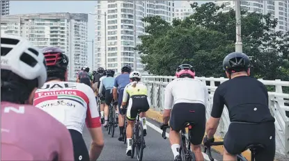  ?? ?? Members ride in the peloton as they take part in an RNCC cycling event in the city.