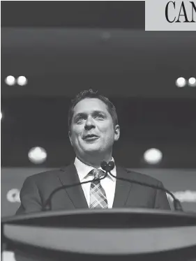  ?? COLE BURSTON/BLOOMBERG ?? “The Conservati­ve Party must be a party for all of its members,” Andrew Scheer said after being elected leader, adding he doesn’t plan to reopen debate on divisive issues.