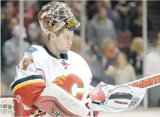  ?? HARRY HOW/ GETTY IMAGES ?? Calgary Flames goalie Joni Ortio is healthy enough to back up Jonas Hiller, which is great news for the organizati­on after Karri Ramo's injury.