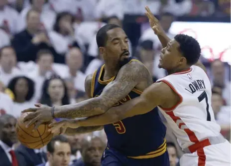  ?? RICK MADONIK/TORONTO STAR ?? Cavaliers guard J.R. Smith, here battling the Raptors’ Kyle Lowry, is an unrestrict­ed free agent yet to come to terms on a new deal in Cleveland.
