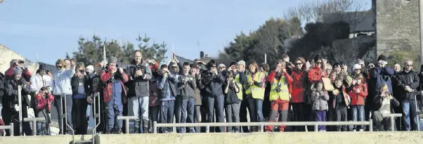  ??  ?? EXPECTATIO­N: Spectators gather on the quayside in Baltimore in west Cork to welcome the new lifeboat, the RNLB the Alan Massey, a Tamar class vessel which is equipped with state-of-the-art communicat­ion and navigation­al equipment. The €3m boat was...