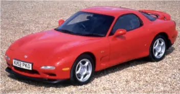  ??  ?? The third generation RX-7 used the 13B-REW engine and had a top speed of 156mph.