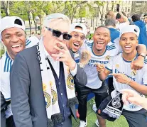  ?? ?? King of cool: Carlo Ancelotti celebrates Real Madrid’s
La Liga victory with his players