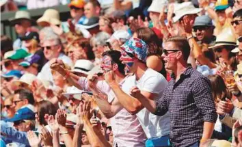  ?? AFP ?? Spectators react as Britain’s Andy Murray wins the third set against US player Sam Querrey at The All England Lawn Tennis Club in Wimbledon yesterday.