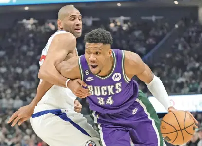  ?? AP PHOTO ?? Los Angeles Clippers’ Nicolas Batum fouls Milwaukee Bucks’ Giannis Antetokoun­mpo during the first half of an NBA basketball game Thursday, Feb. 2, 2023, in Milwaukee.