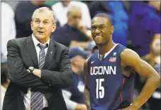  ?? Mel Evans / Associated Press ?? UConn coach Jim Calhoun, left, stands with Kemba Walker during a game against Seton Hall in February 2011.