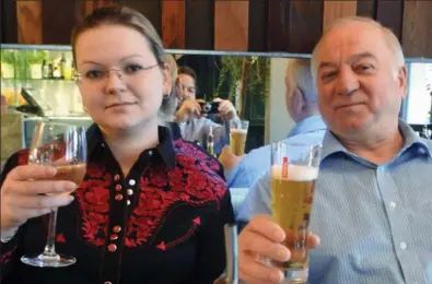  ??  ?? Victims: Sergei Skripal and his daughter Yulia pictured in Zizzi restaurant in Salisbury in 2016