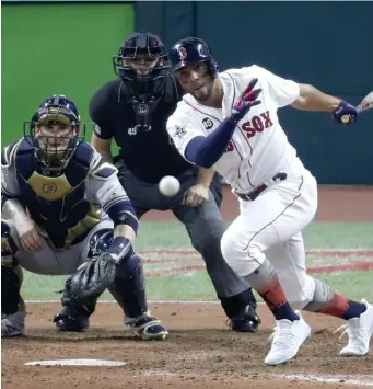  ?? ASSOCIATED PRESS ?? SOX CONNECTION: Xander Bogaerts hits into a double play during the seventh inning of Tuesday’s All-Star Game in Cleveland, where the American League won for the seventh straight year, 4-3.