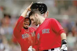  ?? Michael Dwyer Associated Press ?? MOOKIE BETTS, left and J.D. Martinez were teammates on Boston’s World Series winner in 2018. Betts says their friendship goes “way deeper than baseball.”