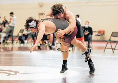  ?? MIKE MANTUCCA/DAILY SOUTHTOWN ?? Lincoln-Way West’s Justin Cronk takes down Lockport’s Paul Rasp in a 182-pound match on May 6.