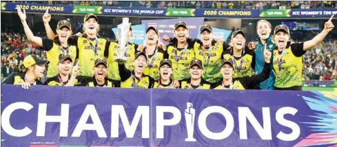  ?? AFP ?? The women’s team have already played and won. Captain Meg Lanning (C) with teammates celebratin­g the women’s cricket World Cup.