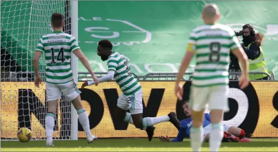  ??  ?? Celtic striker Odsonne Edouard goes down in the box after a challenge by Borna Barisic. The Frenchman was booked for simulation