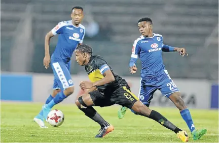  ?? / LEFTY SHIVAMBU / GALLO IMAGES ?? Cape Town City’s Lebogang Manyama tries to weave his magic past Thabo Mnyamane and Teboho Mokoena of SuperSport during last night’s clash in Tshwane.