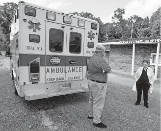 ?? [MICKEY WELSE/MONTGOMERY ADVERTISER] ?? Dr. Karen Kinsell, right, talks with Wayne Royal, Director of Calhoun County EMS and 911, on Thursday at her medical practice in Fort Gaines, Ga.