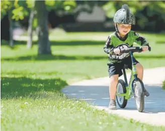  ?? Matthew Jonas, Longmont Times-Call ?? Easton Timbo, 4, rides his Strider bike at Salberg Park in Boulder on Monday. Easton will be racing Saturday, having been bitten by the cycling bug while watching his older brother, Dash, place fourth in a local event a few years ago.