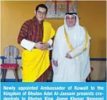  ?? ?? Newly appointed Ambassador of Kuwait to the Kingdom of Bhutan Adel Al-Jassam presents credential­s to Bhutan King Jigme Khesar Namgyel Wangchuck. — KUNA