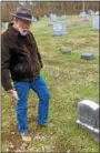  ??  ?? Mark Marshall of East Poestenkil­l checks out the grave of Hazel Drew, the Troy woman whose 109-year-old murder is the basis for the 1990s TV cult classic “Twin Peaks.”