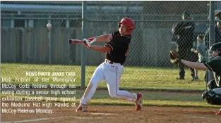  ?? NEWS PHOTO JAMES TUBB ?? Matt Fritzler of the Monsignor McCoy Colts follows through his swing during a senior high school exhibition baseball game against the Medicine Hat High Hawks at McCoy Field on Monday.