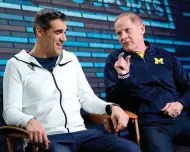  ?? David J. Phillip/The
Associated Press ?? ■ Villanova head coach Jay Wright, left, and Michigan head coach John Beilein answer
questions on Sunday during an interview for CBS Sports Network's
"We Need to Talk" show before
the Final Four college basketball tournament in
San Antonio.