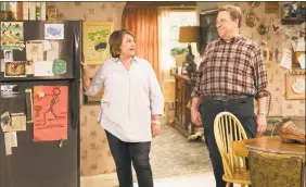  ??  ?? Roseanne Barr, left, and John Goodman in a scene from the comedy series “Roseanne.”