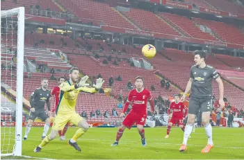  ??  ?? David de Gea catches the ball during the English Premier League football match between Liverpool and Manchester United at Anfield in Liverpool. - AFP photo