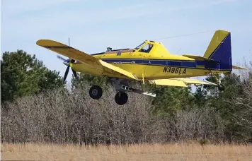  ?? Staff photo by Neil Abeles ?? ■ The airplane looks small but it’s actually an Air Tractor A-802 turboprop, which is a powerful airplane. It is lifting a 2,300 pound load into the air at the moment.