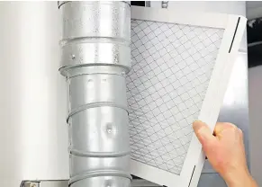  ??  ?? Replacing the air filter in your home’s furnace will help it run more efficientl­y, and it’s an easy job to do yourself.