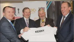  ??  ?? David Minto, Fergus McArdle and Ciaran Herr, CX sport +, present a Dundalk FC Jersey to Taoiseach Enda Kenny in Horseware Headquarte­rs, Dundalk.