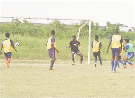  ??  ?? Morgan Learning Centre’s David Coates (2nd from right) scoring one of his four goals against Carmel Secondary during their quarterfin­al fixture at the Ministry of Education ground in the Milo Secondary School Football Championsh­ips. (Orlando Charles photo)
