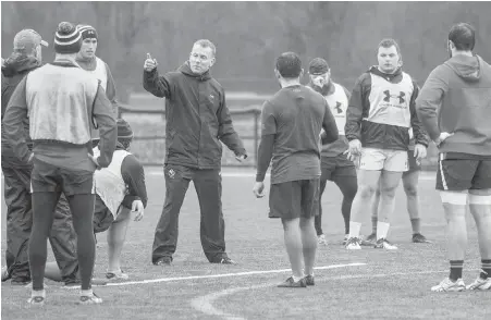  ??  ?? Head coach Kingsley Jones puts his Canadian troops through drills during a recent practice at Westhills Stadium.