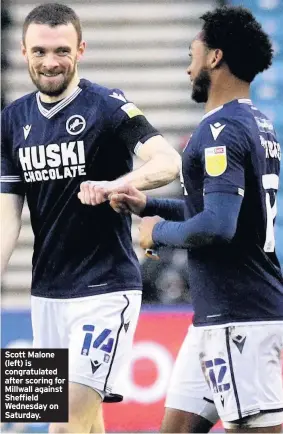  ??  ?? Scott Malone (left) is congratula­ted after scoring for Millwall against Sheffield Wednesday on Saturday.