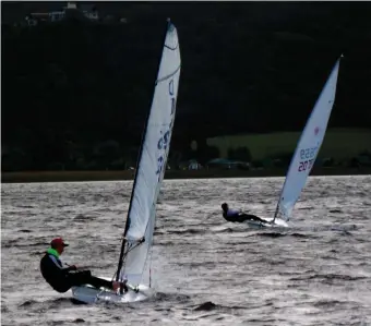  ??  ?? Matthew de Villiers (Dabchick) with Georgou Divaris (Laser) beating in strong wind at the start of the race.