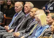  ?? Bonnie Cash/Bloomberg ?? President Joe Biden and House Speaker Kevin McCarthy, R-Caif., second from left, appeared together Thursday at the National Prayer Breakfast at the Capitol.