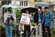  ?? Arnold Gold/Hearst Connecticu­t Media ?? Yale University graduate students Avery Eddy, left, Lukey Ellsberg, center, and Miguel Monteiro, far right, participat­e in a news conference concerning the Graduate Students for Palestine hunger strike, on Friday at Yale University’s Cross Campus in New Haven.