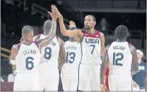  ?? CHARLIE NEIBERGALL THE ASSOCIATED PRESS ?? United States’ Kevin Durant (7) celebrates with teammate Damian Lillard (6) during a men’s basketball preliminar­y round game against the Czech Republic at the delayed 2020 Summer Olympics on Saturday in Saitama, Japan.