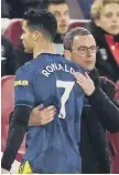  ?? ?? Ralf Rangnick with Cristiano Ronaldo as he is substitute­d.