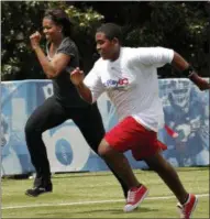  ?? GERALD HERBERT — THE ASSOCIATED PRESS ?? In this 2010file photo, First lady Michelle Obama runs a 40-yard sprint as she participat­es in the Let’s Move! Campaign and the NFL’s Play 60Campaign festivitie­s with area youth, to promote exercise and fight childhood obesity, in New Orleans.