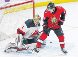  ?? CP PHOTO ?? Ottawa Senators Jean-Gabriel Pageau(44) screens New Jersey Devils goaltender Keith Kinkaid (1) on a goal by Senators Christophe­r DiDomenico (not shown) during first period NHL action last month in Ottawa.