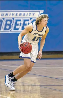  ?? RYAN TURELL, Courtesy of Yeshiva University ?? who plays with a kippah on, led Yeshiva to the Sweet 16 in last year’s NCAA Division III tournament, but the coronaviru­s ended that run.