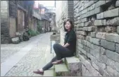  ??  ?? Chang Sin-yee in an old village in Fujian province.