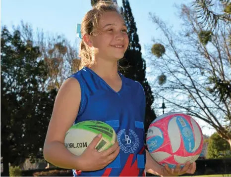  ?? PHOTO: ANTON ROSE ?? DOUBLING UP: Emily Dolley was selected to represent the Darling Downs in both netball and rugby league.