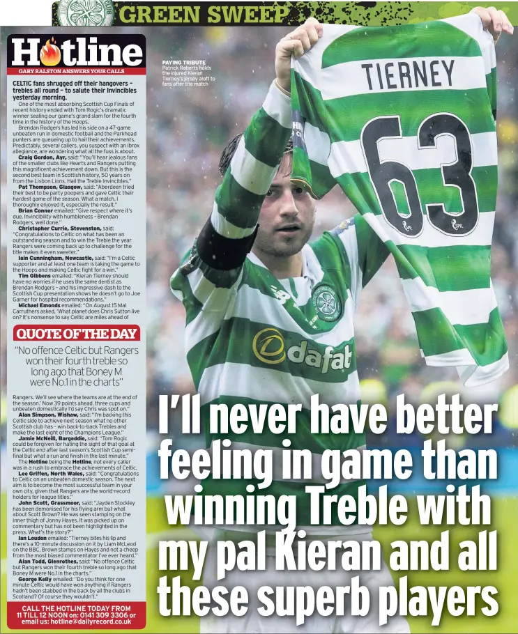  ??  ?? PAYING TRIBUTE Patrick Roberts holds the injured Kieran Tierney’s jersey aloft to fans after the match