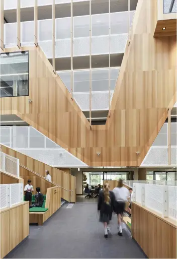  ??  ?? A vertical layout, as at Adelaide Botanic High School, provides opportunit­ies for collaborat­ion and connection that are not available in traditiona­l low-rise school buildings.