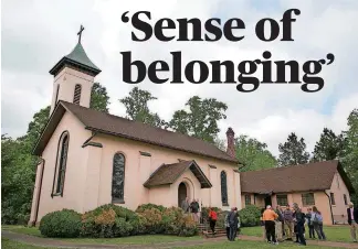  ?? [PHOTO BY JULIA RENDLEMAN, FOR THE WASHINGTON POST] ?? Churchgoer­s mingle recently after the service at Martin’s Brandon Episcopal Church’s 400th anniversar­y celebratio­n. This building dates to 1856.