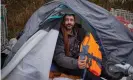  ?? Photograph: David Levene/The Guardian ?? Karwan Tahir, from the Kurdish city of Sulaymaniy­ah, displays the lifejacket he has bought in readiness for crossing the Channel.