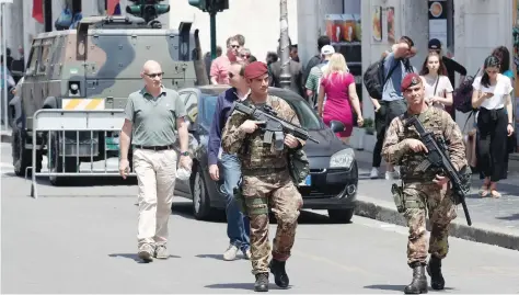  ?? — Reuters ?? Italian Army officers patrol the area around the Vatican, in Rome, Italy, on Tuesday.